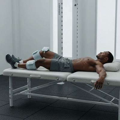 Athlete recovering after a workout, showing muscle recovery